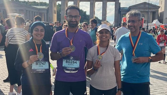 Pakistani runners pose for a group photo after running in the Berlin Marathon. — Reporter