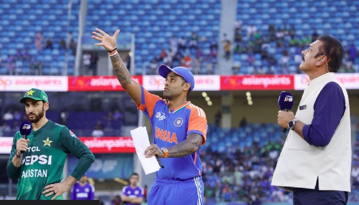 Pakistan skipper Salman Ali Agha (left) and India captain Suryakumar Yadav (centre) at the toss for Asia Cup 2025s Super Fours match at Dubai International Cricket Stadium, Dubai, UAE, on September 21, 2025. — ACC