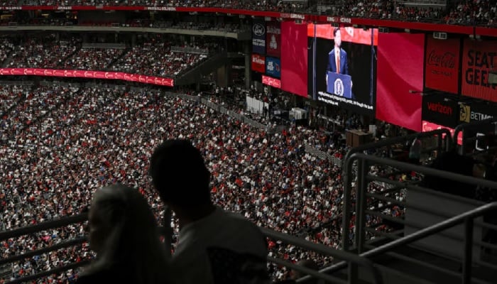A screen shows US Vice President JD Vance as he speaks, while people attend a memorial service for slain conservative commentator Charlie Kirk at State Farm Stadium, in Glendale, Arizona, US, September 21, 2025.— Reuters