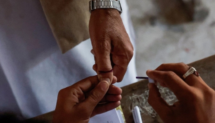 A voter gets an ink mark on his thumb after casting his vote during the general election in Karachi — Reuters/File