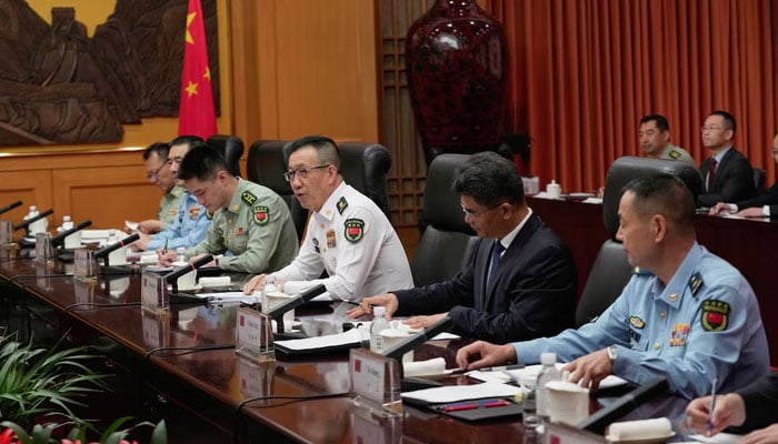 Chinese Defense Minister Dong Jun speaks with Rep. Adam Smith (D-WA), not pictured, who leads a bipartisan group of US lawmakers for a meeting at the Ministry of Defense in Beijing, China, September 22, 2025.— Reuters