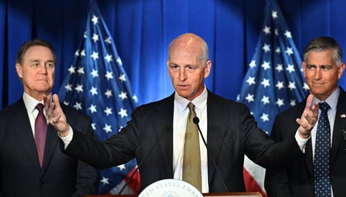US Representative Adam Smith, flanked by US Ambassador to China David Perdue (left) and Michael Baumgartner, Republican member of House Foreign Affairs Committee during a press conference at the US embassy in Beijing, September 23, 2025. — AFP