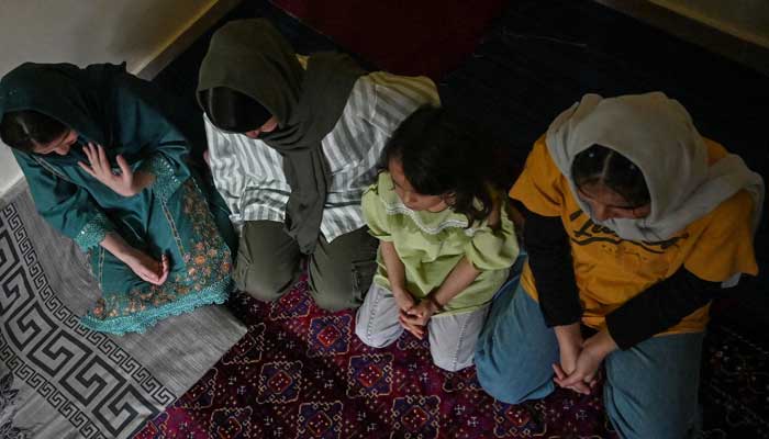 Afghan refugee girls Shayma (L), Zahra (2L) and Laylama (R) are pictured during an interview with AFP at their residence in Islamabad on September 2, 2025. — AFP
