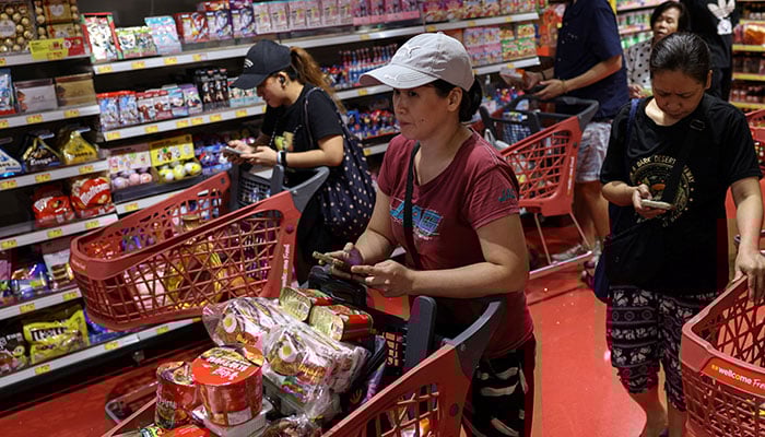 Residents stock up on supplies at a supermarket to prepare for the approaching Typhoon Ragasa, in Hong Kong, China, September 22, 2025. — Reuters