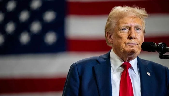 US President Donald Trump speaks to attendees during a campaign rally at the Mosack Group warehouse in Mint Hill, North Carolina on September 25, 2024. — AFP