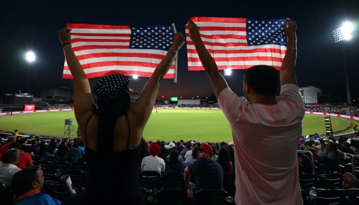 USA fans cheer their team with flags, USA vs Canada, T20 World Cup 2024, Group A, Dallas, June 1. — ICC