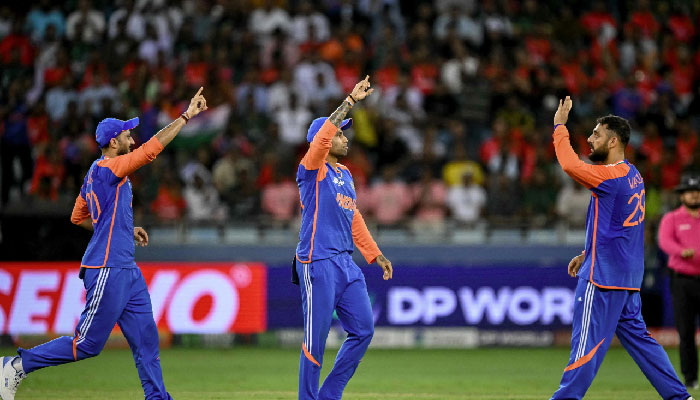 Indias captain Suryakumar Yadav (C) celebrates with teammates after the dismissal of Bangladeshs captain Jaker Ali during the Asia Cup 2025 Super Fours match between Bangladesh and India at the Dubai International Stadium in Dubai on September 24, 2025. — AFP