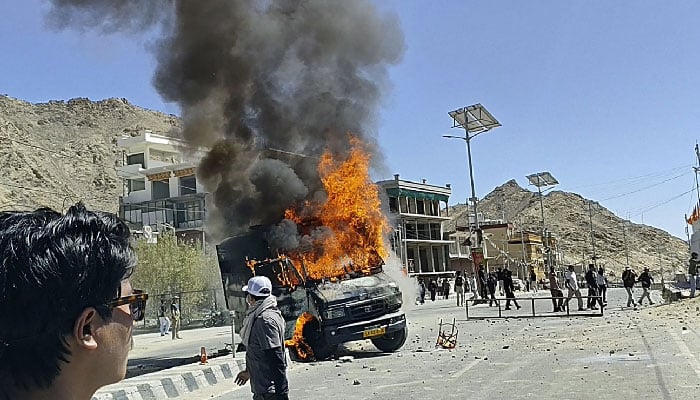 A police vehicle torched by the demonstrators is pictured along a street near the Bharatiya Janata Party (BJP) office in Leh on September 24, 2025. — AFP