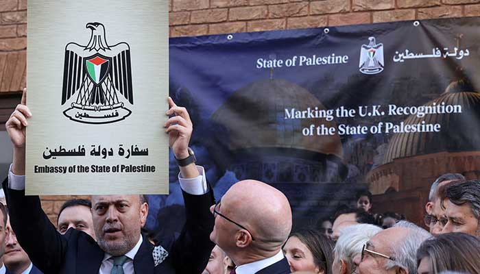 Husam Zomlot, head of the Palestinian mission to the UK, holds up a plaque which reads Embassy of the State of Palestine during a ceremony after the British government announced formal recognition of a Palestinian state, at the missions headquarters in London, Britain, September 22, 2025. — Reuters