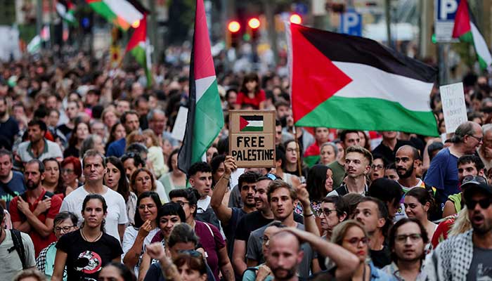 A demonstrator holds up a sign reading Free Palestine during a protest in support of Palestinians, in Barcelona, Spain, September 18, 2025. — Reuters