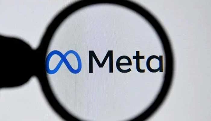 Image showing the logo of Meta through a magnifying glass. — AFP/File