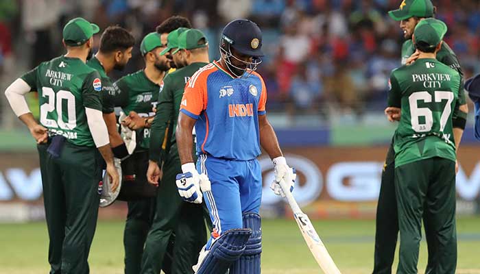 Indias Sanju Samson walks after being bowled out by Pakistans Haris Rauf during Asia Cup 2025 match in Dubai on September 21, 2025. — Reuters