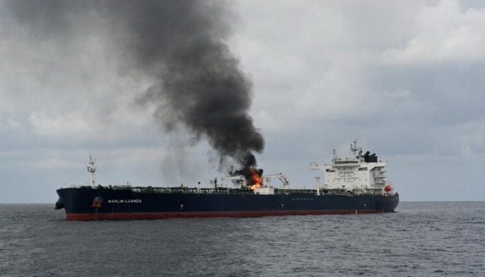 Smoke rises from Marlin Luanda, merchant vessel, after the vessel was struck by a Houthi anti-ship missile, at the location given as Gulf of Aden, in this handout picture released January 27, 2024. — Reuters
