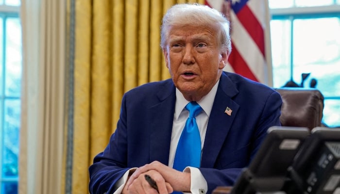 US President Donald Trump speaks as he signs documents in the Oval Office at the White House in Washington, US, February 4, 2025. — Reuters