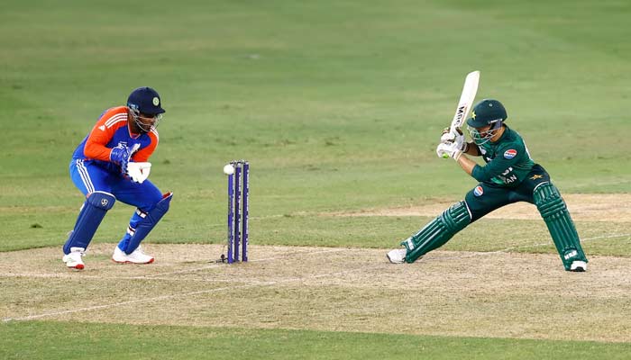 Pakistans Salman Ali Agha in action with Indias Sanju Samson in the Asia Cup Group A match between Pakistan and India at Dubai International Cricket Stadium, United Arab Emirates on September 21, 2025. — Reuters
