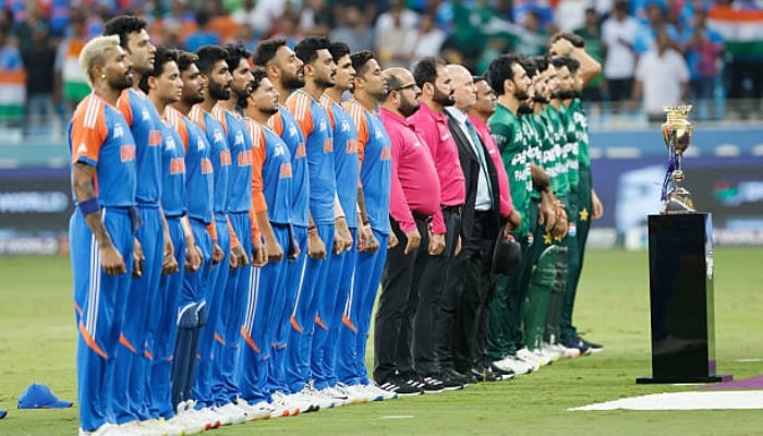 Pakistani and Indian players stand at national anthem during the match at Dubai International Stadium on September 21, 2025, in Dubai, United Arab Emirates. — AFP
