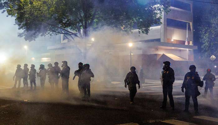 Tear gas and smoke envelop ICE agents as people protest against the US President Donald Trump administrations immigration policies, outside an ICE detention facility in Portland, Oregon, US, September 1, 2025.— Reuters