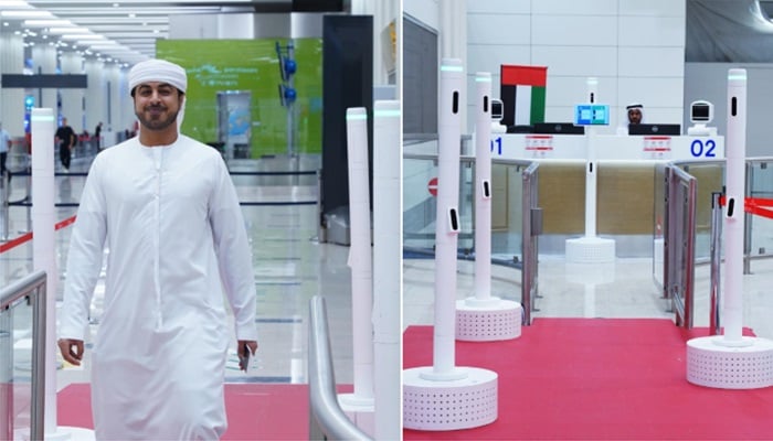Passengers walk through Dubai International Airport’s new AI-powered Smart Red Carpet Corridor on September 27, 2025, which lets travellers clear immigration in seconds.—GDRFA Dubai