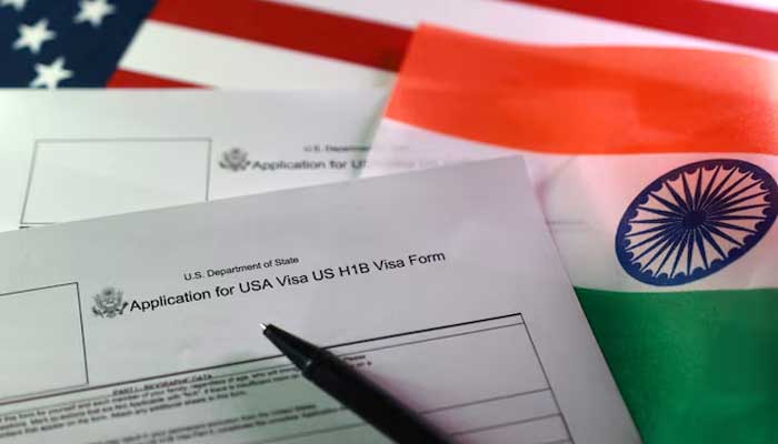 US, Indian flags and US H-1B Visa application forms are seen in this illustration taken on September 22, 2025. — Reuters