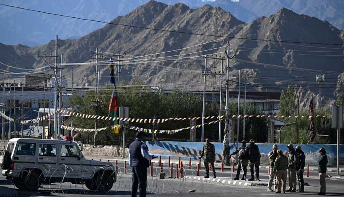 Security personnel stand guard along a road during a curfew in Leh on September 28, 2025. India´s remote high-altitude desert region of Ladakh has been in turmoil since four people were killed in violent protests on September 24 demanding greater political autonomy for the Himalayan territory. — AFP