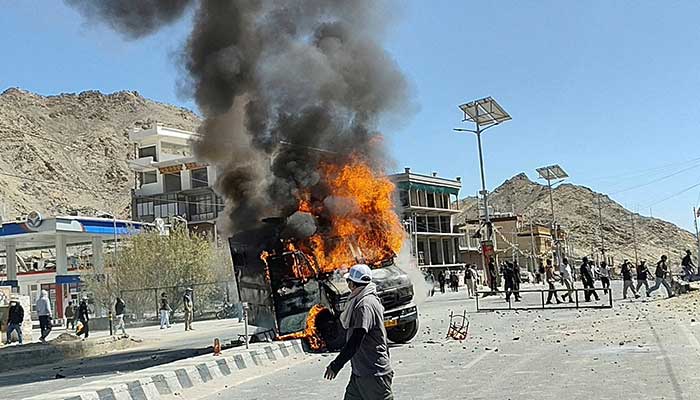 A vehicle is set on fire during a protest by locals demanding statehood for the federal territory and job quotas for local residents in Leh, in the Ladakh region, India, September 24, 2025. — Reuters