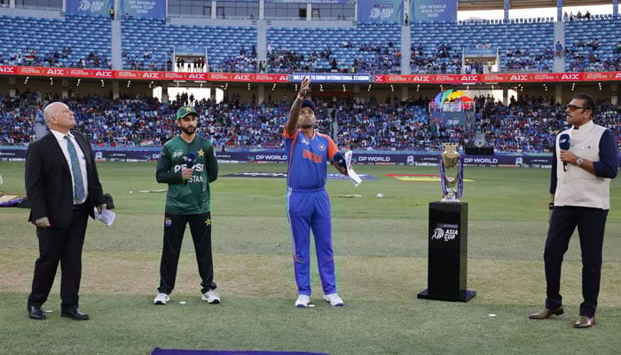 Former India cricketer Ravi Shastri (right) serves as presenter at the toss for the ACC Mens T20 Asia Cup 2025 match between Pakistan and India at the Dubai International Cricket Stadium in Dubai on September 14, 2025. — ACC