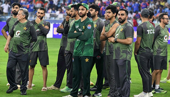 Pakistans cricket team members wait for the presentation ceremony at the end of the ACC Mens T20 Asia Cup 2025 final match between India and Pakistan at the Dubai International Stadium in Dubai on September 28, 2025. — AFP