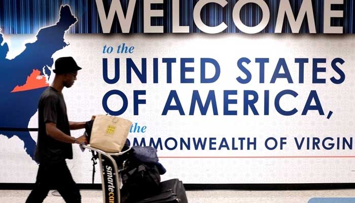 A man exits the transit area after clearing immigration and customs on arrival at Dulles International Airport in Dulles, Virginia, US. — Reuters/File