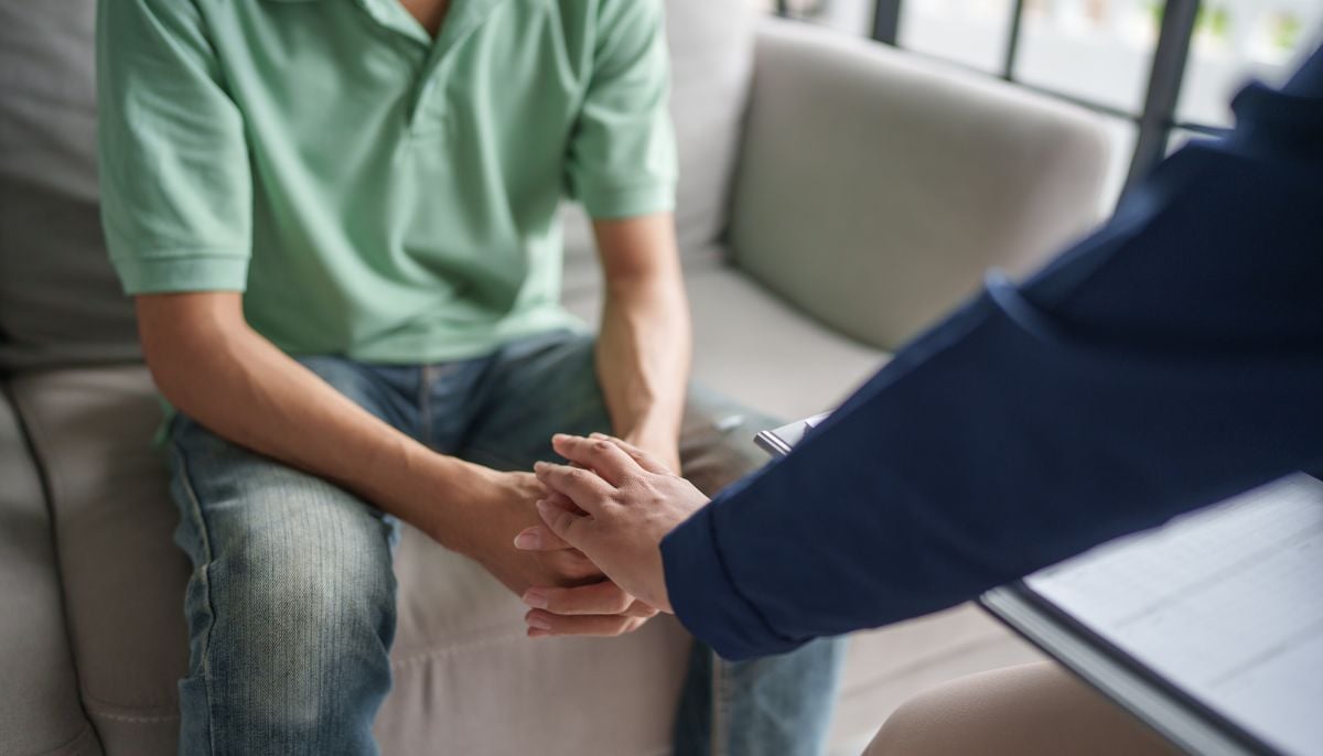 A representational image of a person during a psychotherapy session. — Canva