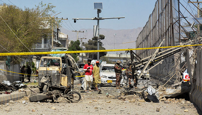 Paramilitary soldiers and rescue workers stand amid the debris after a bomb blast near the Frontier Corps headquarters in Quetta, Pakistan September 30, 2025. — Reuters