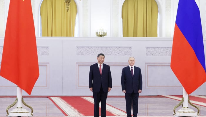 Russian President Vladimir Putin and his Chinese counterpart Xi Jinping pose for a photograph at the Kremlin in Moscow. — Reuters/File