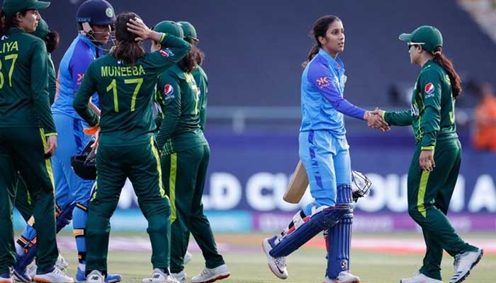 Pakistani and Indian womens team players shake hands after World Cup at Newlands Stadium in Cape Town on February 12, 2023. — AFP