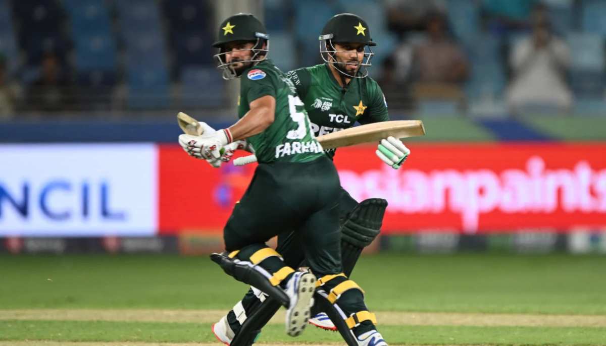 Mohammad Haris and Sahibzada Farhan run between the wickets during Pakistans Asia Cup match against Oman on September 12, 2025. — AFP