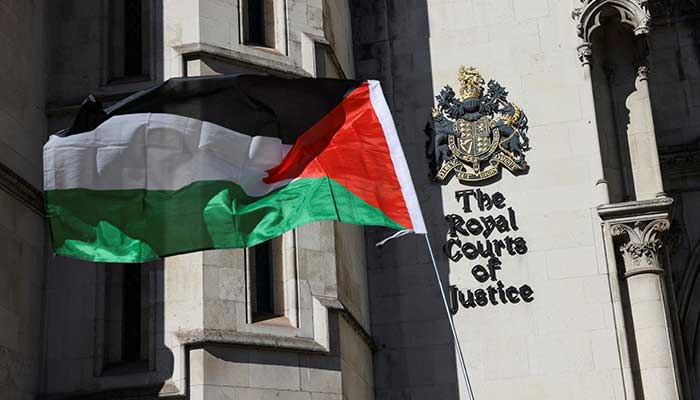 A Palestinian flag is held up outside the Royal Courts of Justice in London, Britain, on September 25, 2025. — Reuters
