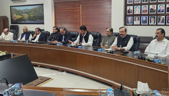 A high-level delegation of the government hold negotiation with the Joint Awami Action Committee in Muzaffarabad on October 2, 2025. —X/ @DrTariqFazal