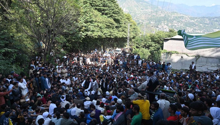 Awami Action Committee (AAC) activists gather during a demonstration in Muzaffarabad on October 1. — AFP