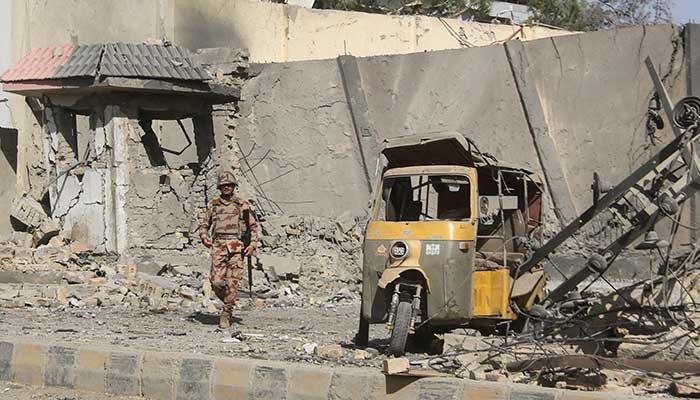 A soldier walks amid the damages after a bomb blast near the Frontier Corps headquarters in Quetta on September 30, 2025. — Reuters
