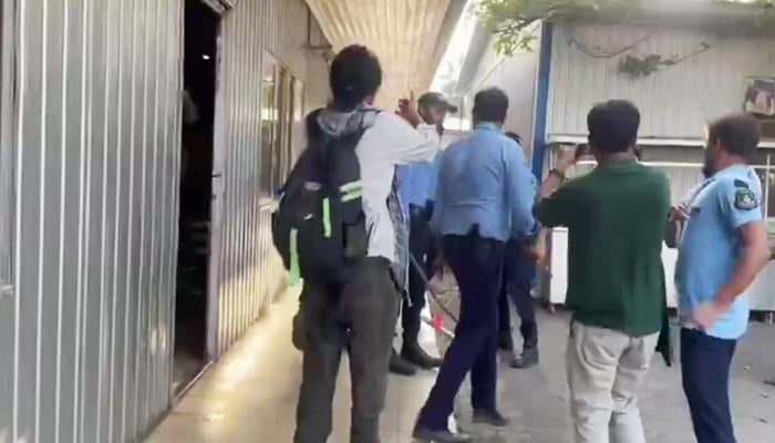 Police personnel assault journalists after storming National Press Club in Islamabad, on October 2, 2025. — Geo News
