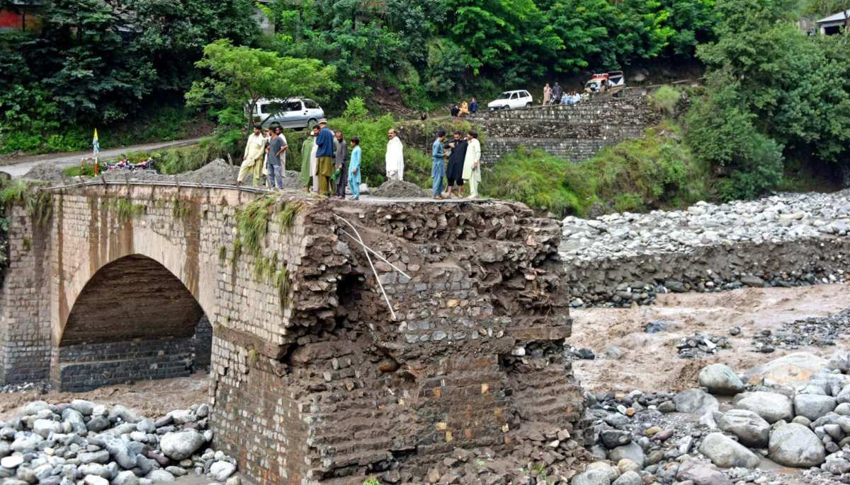 Flood waters smashed through a bridge on the outskirts of Muzaffarabad in Azad Kashmir. — AFP/File