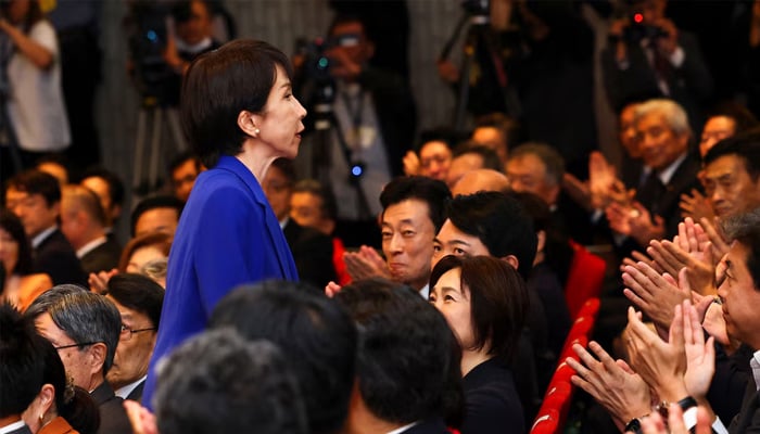 Newly-elected Liberal Democratic Party (LDP) leader Sanae Takaichi reacts as she receives an applause from gathered lawmakers on the day of the LDP leadership election in Tokyo, Japan, October 4, 2025. — Reuters