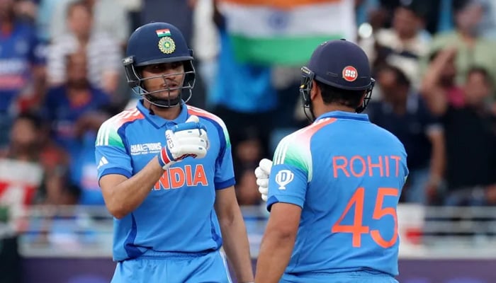 Indias Shubhman Gill and Rohit Sharma bump their fists during a match. — Reuters