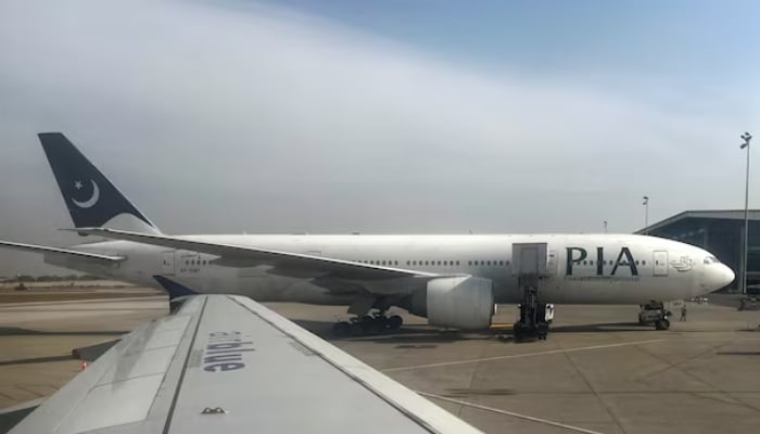 Pakistan International Airlines (PIA) passenger plane sits on tarmac, as seen through a plane window, at the Islamabad International Airport, Islamabad, Pakistan October 27, 2024. — Reuters