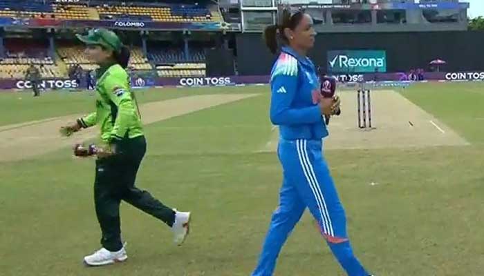 Pakistan, India captains walk past each other during toss at ICC Womens World Cup on October 5, 2025. — Screengrab via Geo News
