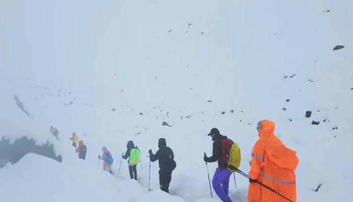 A screen capture from video shows trekkers leaving their campsite, as unusually heavy snow and rainfall pummeled the Himalayas, in the Tibet Region, China, October 5, 2025. — Reuters