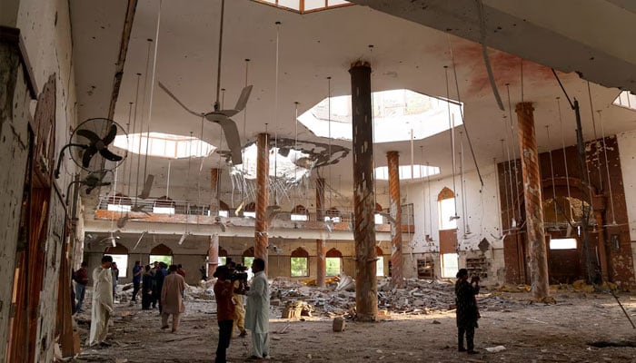 Members of the media film the inside of a building after it was hit by an Indian strike in Bahawalpur, Pakistan, May 7, 2025. — Reuters