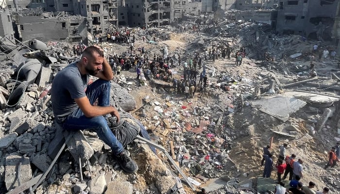 A man gestures as Palestinians search for casualties a day after Israeli strikes on houses in Jabalia refugee camp in the northern Gaza Strip, November 1, 2023. —  Reuters