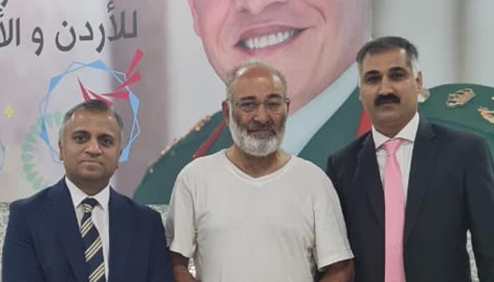 Former senator Mushtaq Ahmad with Pakistani embassy officials in Amman after release from Israeli custody. — X/@MIshaqDar50