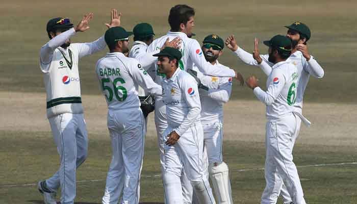 Pakistan´s Shaheen Shah Afridi (C) celebrates with teammates after taking the wicket of South Africa´s Temba Bavuma (not pictured) during the fifth and final day of the second Test cricket match between Pakistan and South Africa at the Rawalpindi Cricket Stadium in Rawalpindi on February 8, 2021. -AFP