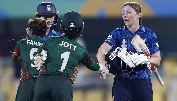Englands Heather Knight shakes hands with Bangladesh players after winning the game on October 7, 2025. — Reuters