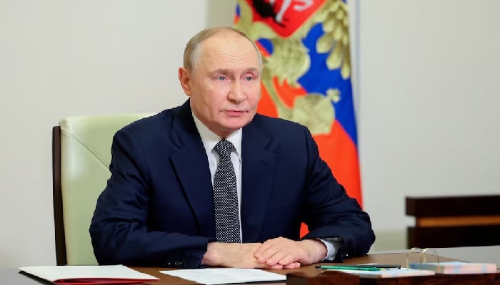 Russian President Vladimir Putin chairs a meeting with members of the Security Council via a video link at the Novo-Ogaryovo state residence outside Moscow, Russia, October 7, 2025. — Reuters